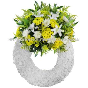 Corona con Lilium, Anastasias, Margaritas, Solidagos y Claveles